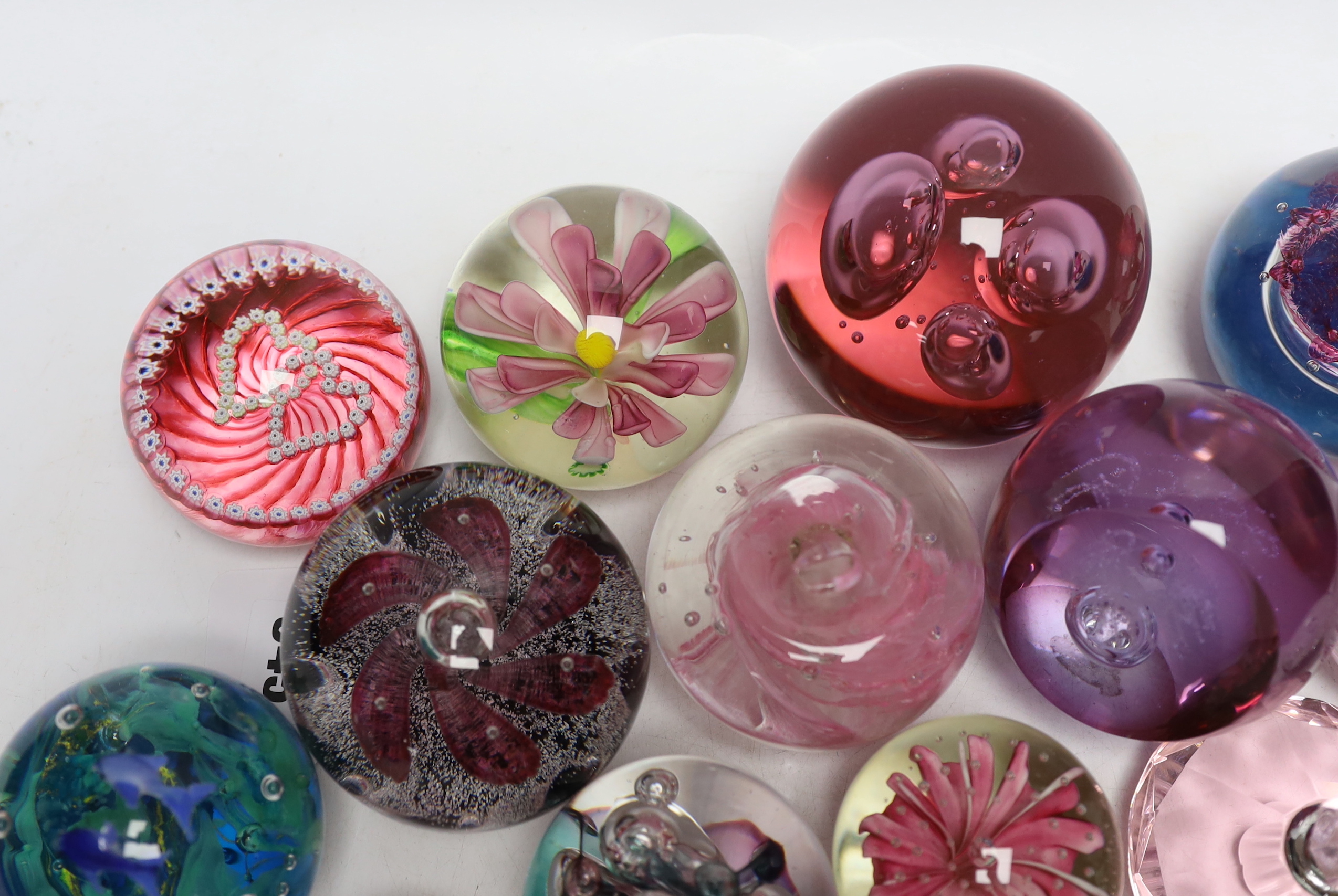 A group of glass paperweights including Caithness